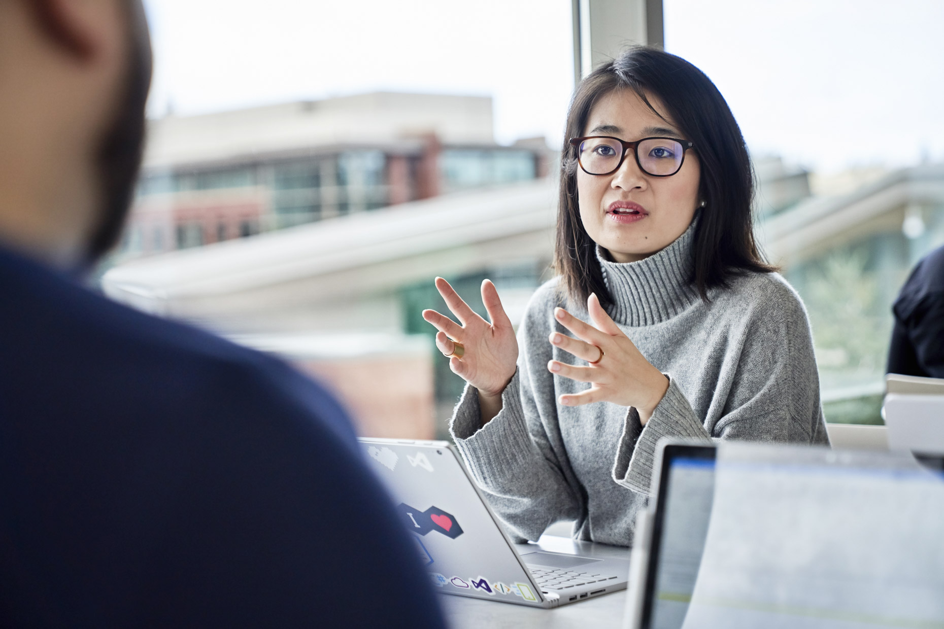 Asian woman talking during work meeting 