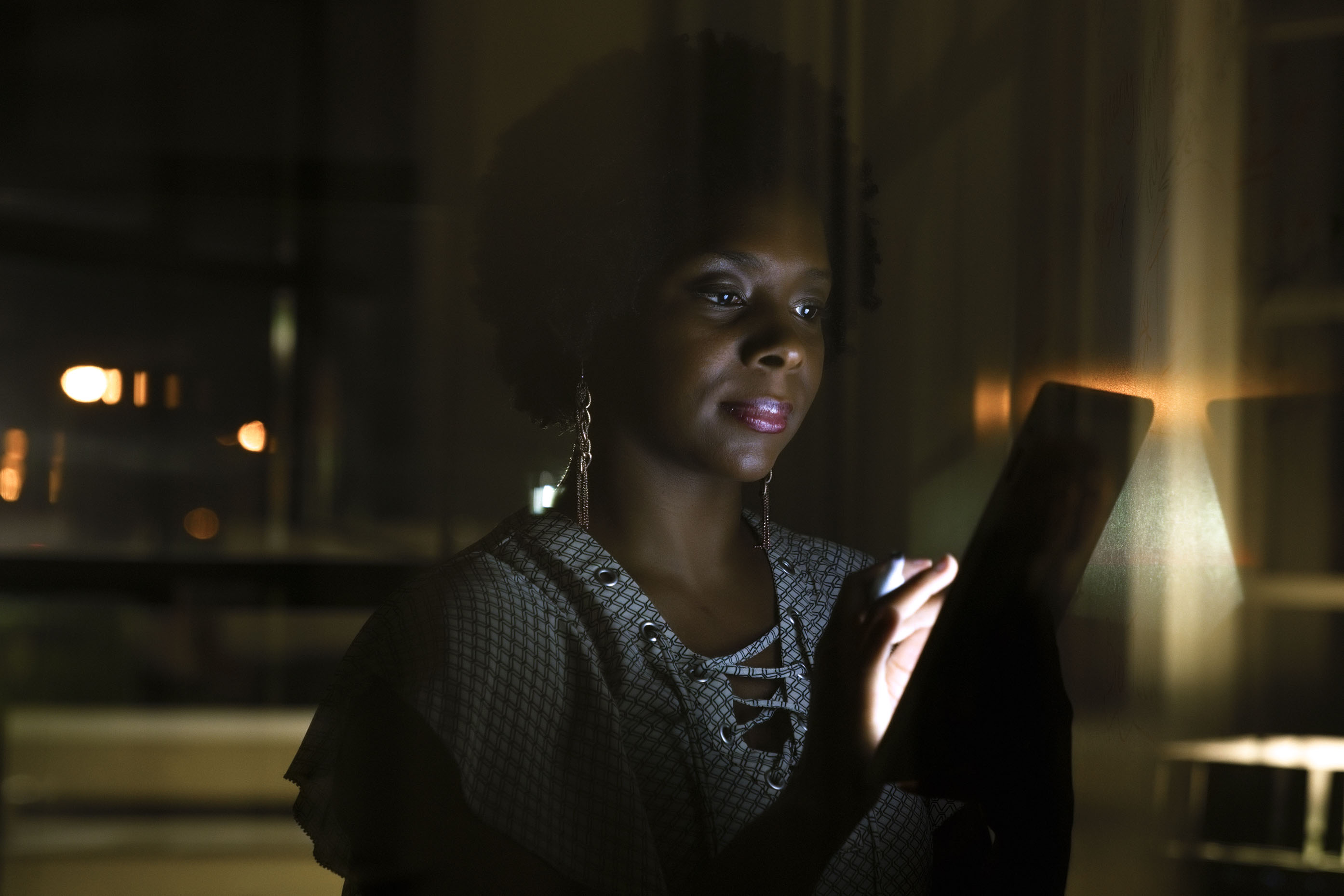 Black-woman-working-on-tablet-computer-at-night-Inti-St-Clair-LYDA_201703273114