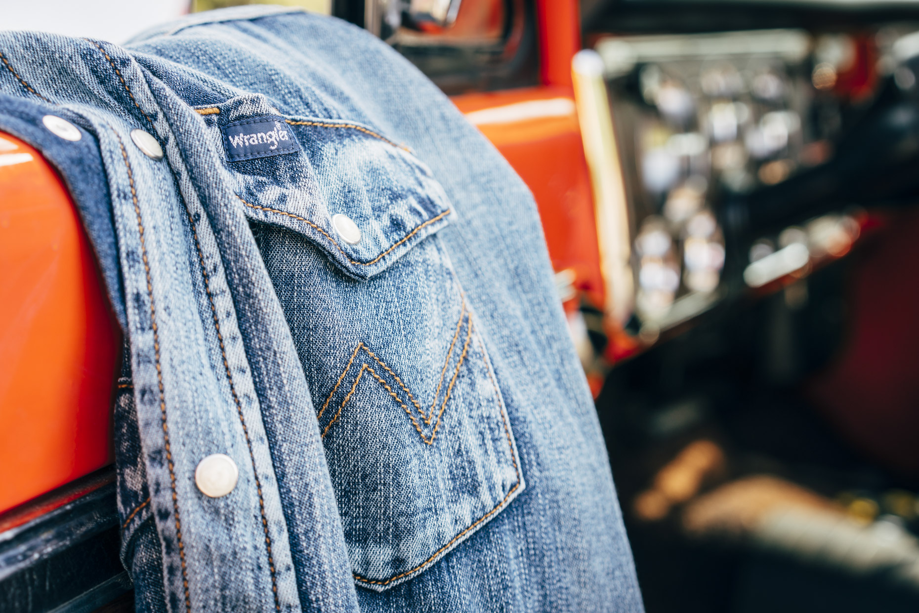 Close up of Wrangler Denim shirt hanging on truck door