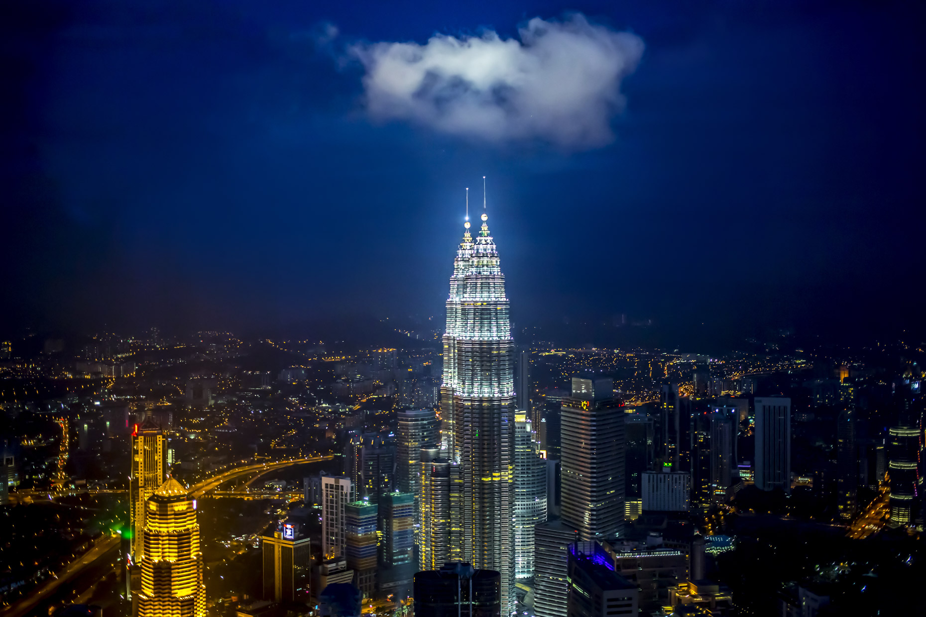 Cloud over Petronas Towers at night in Kuala Lumpur