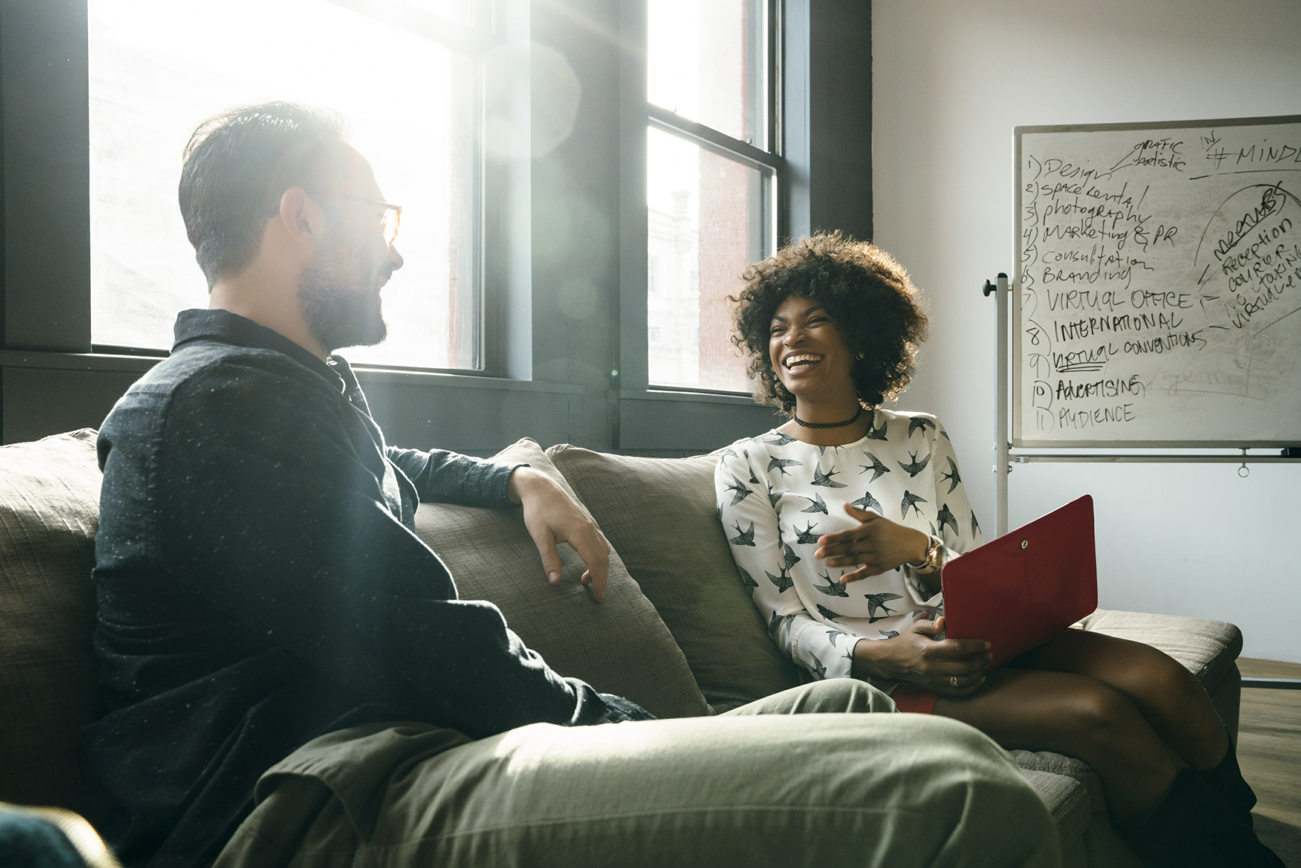 Couple working on office couch