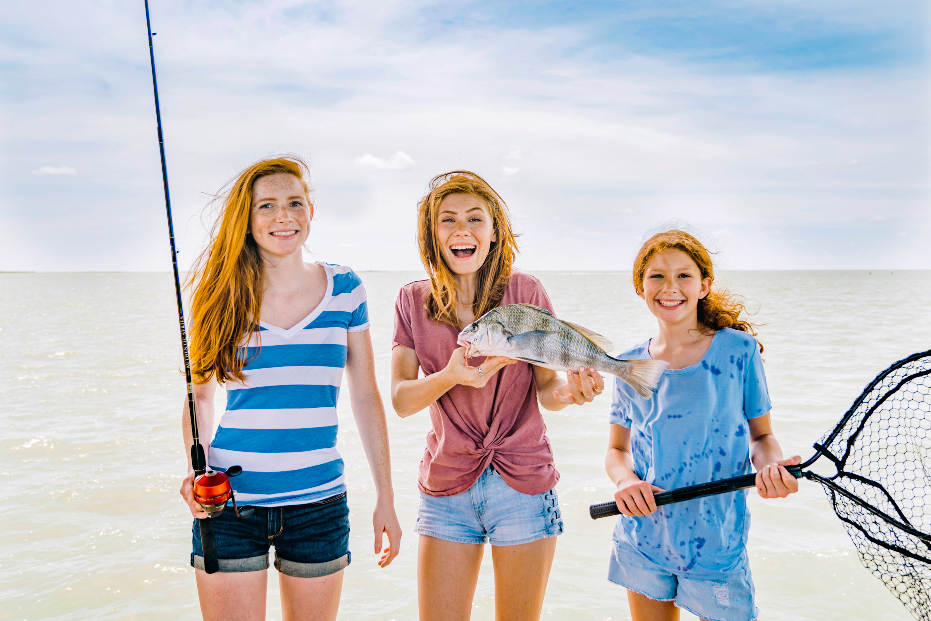 Happy-teen-girls-with-fish-they-caughtInti-St-Clair-Austin-TX