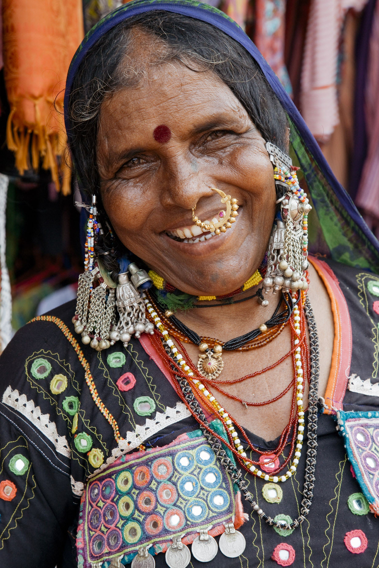 Portrait of laughing Indian woman with gold nose ring
