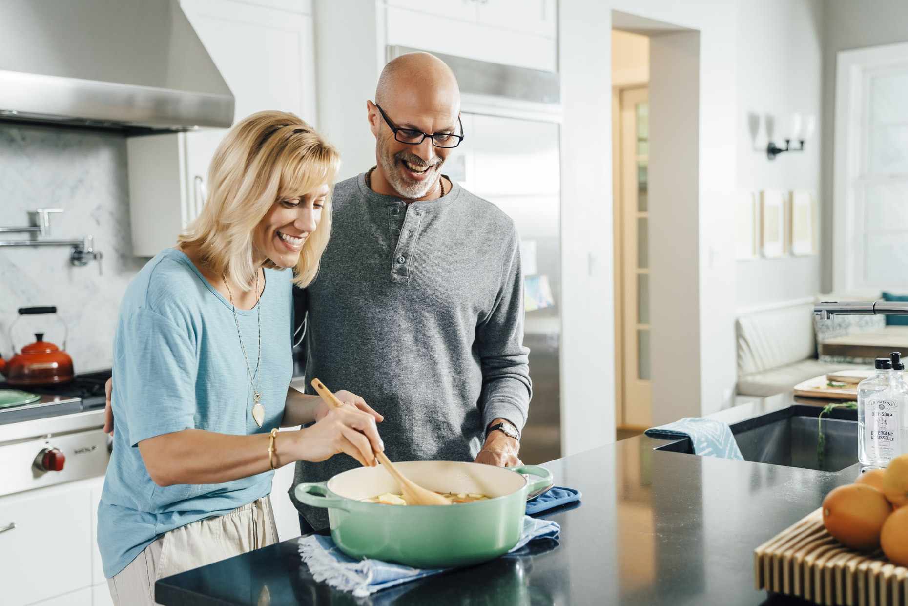 Man woman cooking together in kitchen
