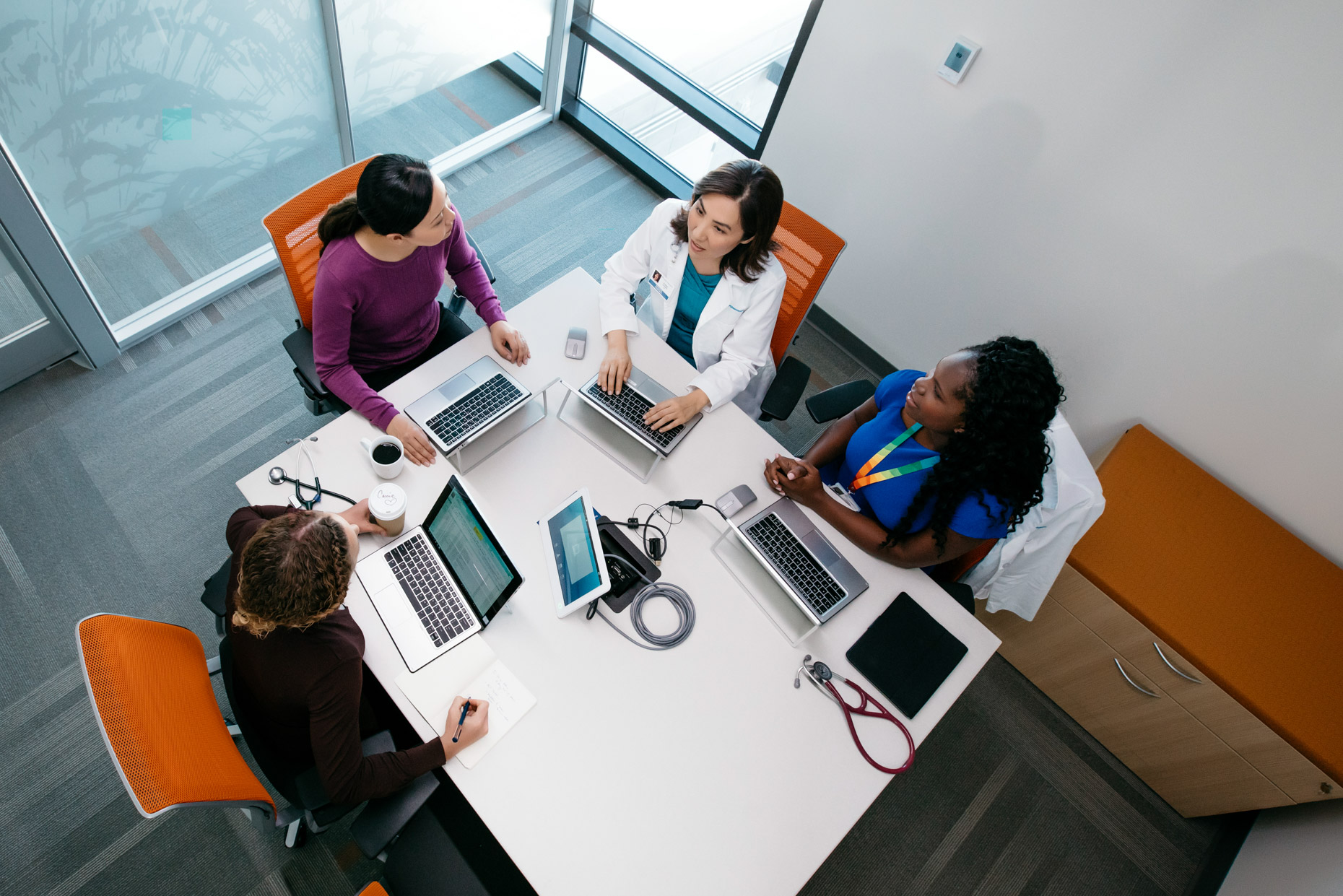 Overhead view of female doctors in conference room