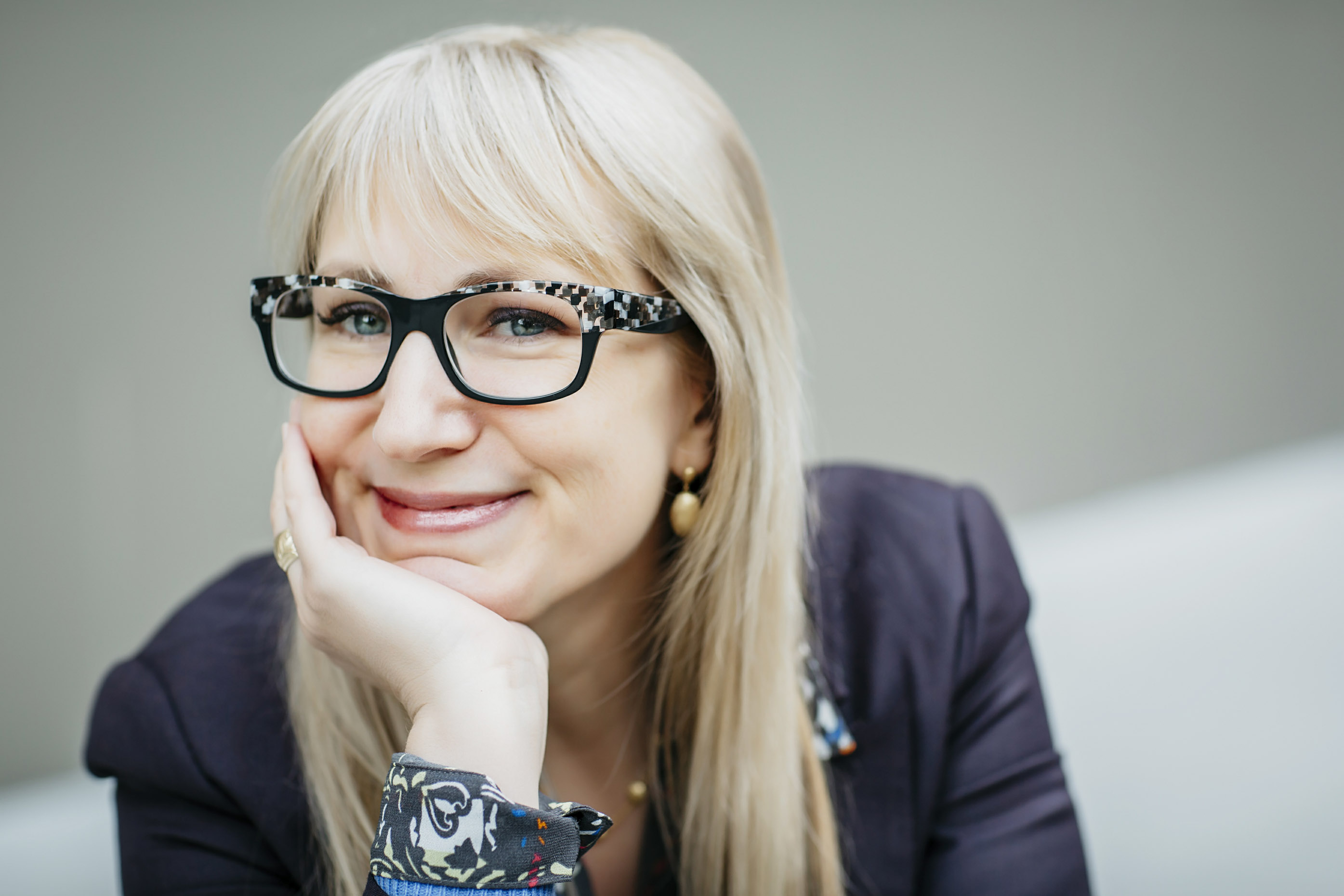 Portrait-business-woman-glasses-chin-hand-Inti-St-Clair-is201512110226