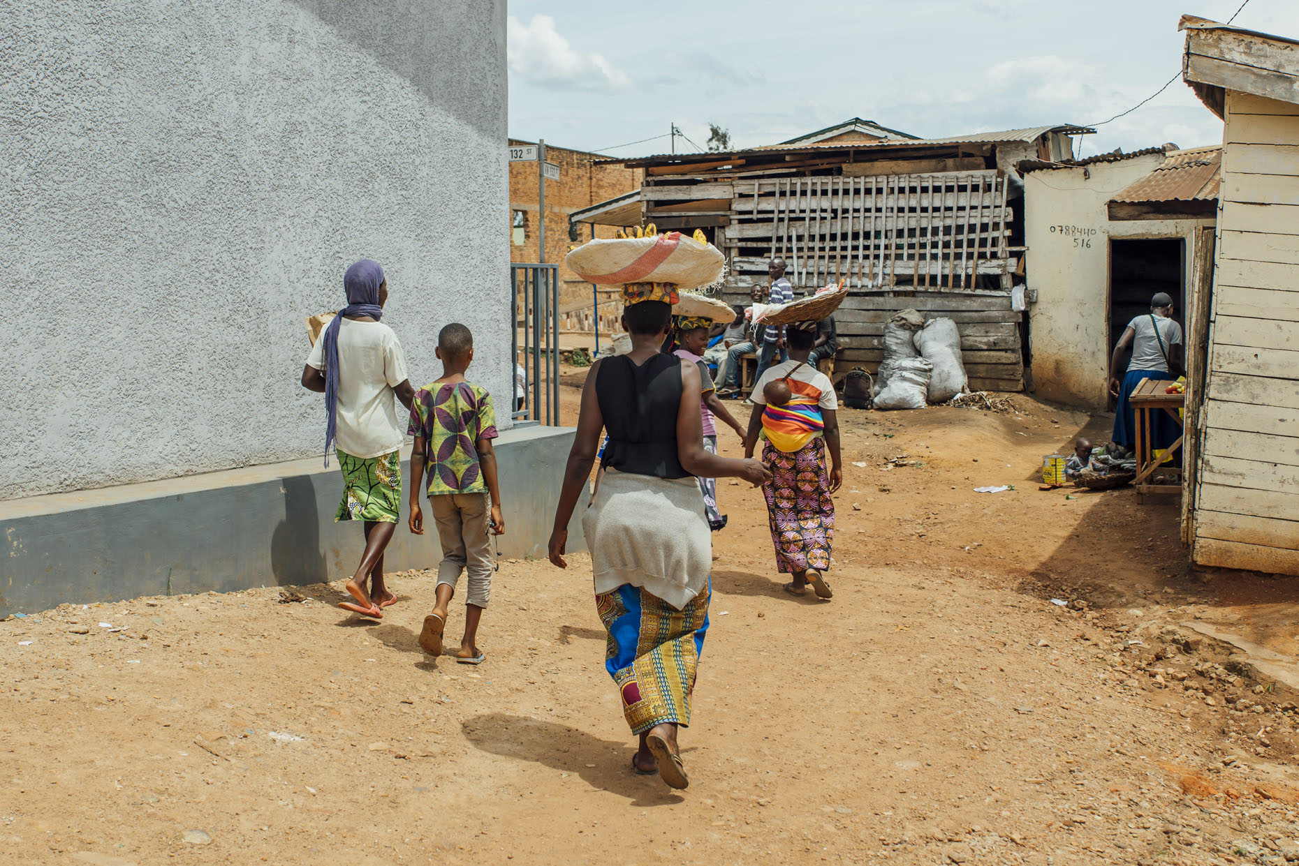 Street scene in Kigali Rwands with women carrying fruit in baskets on head