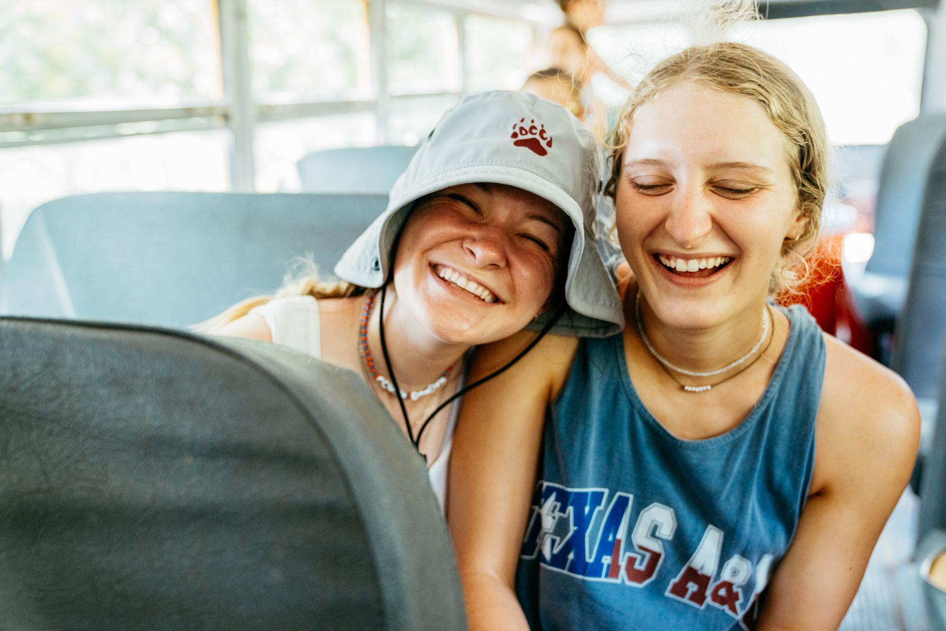 Teen-girl-campers-smiling-on-bus-is20210716_Deer_Creek_8690