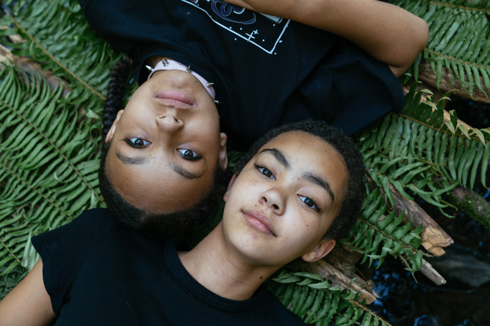 Teens-laying-down-outside-on-ferns-from-above-is20210705_0916