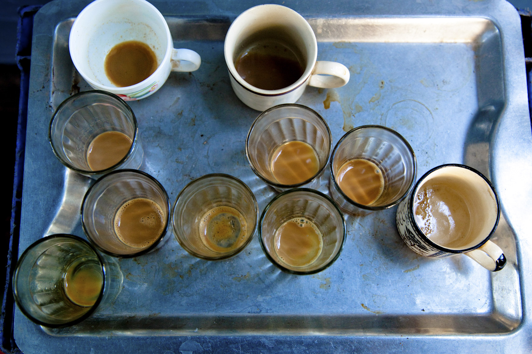 Tray of empty chai tea cups 