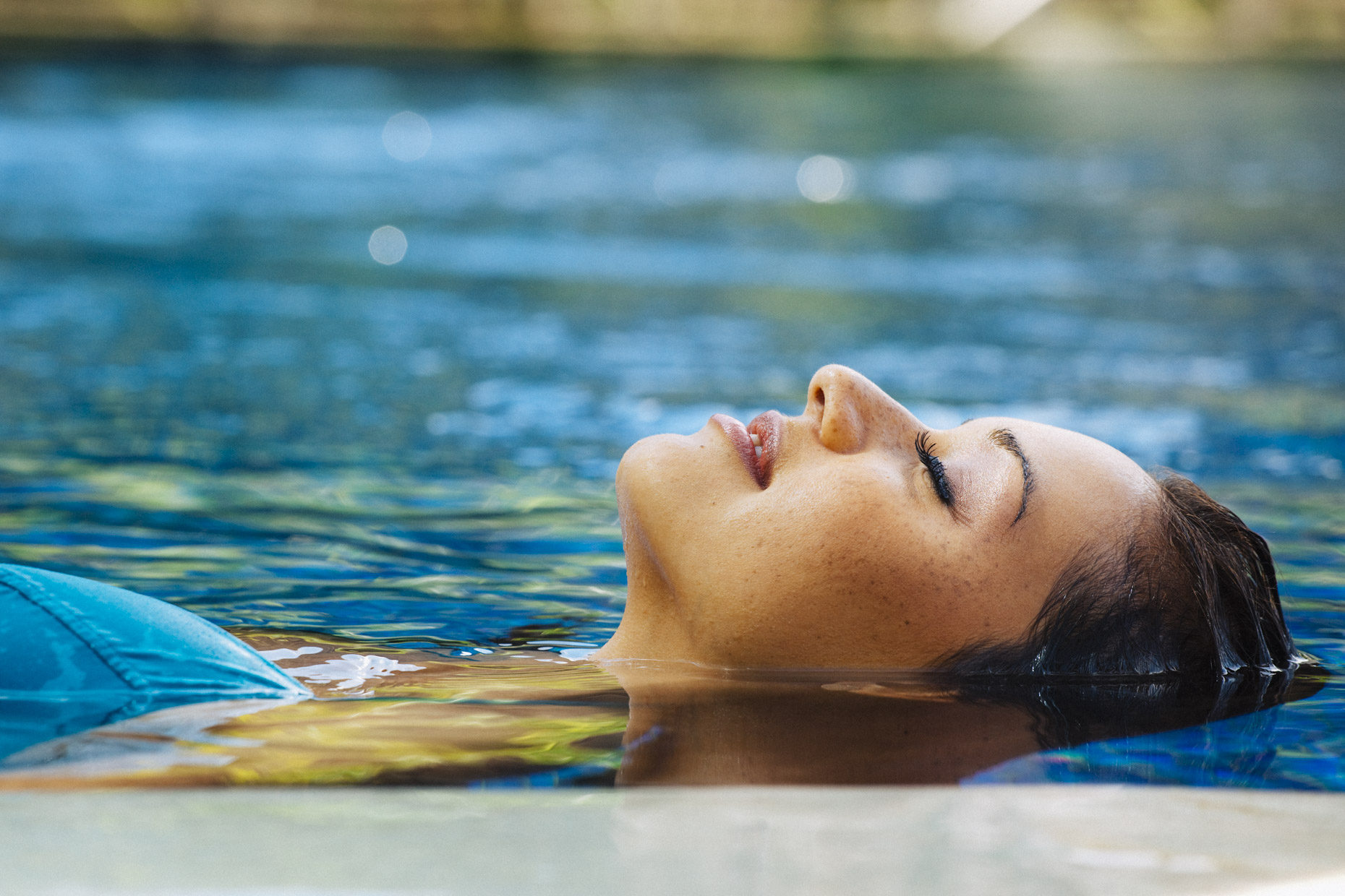 Woman floating in hotel resort pool