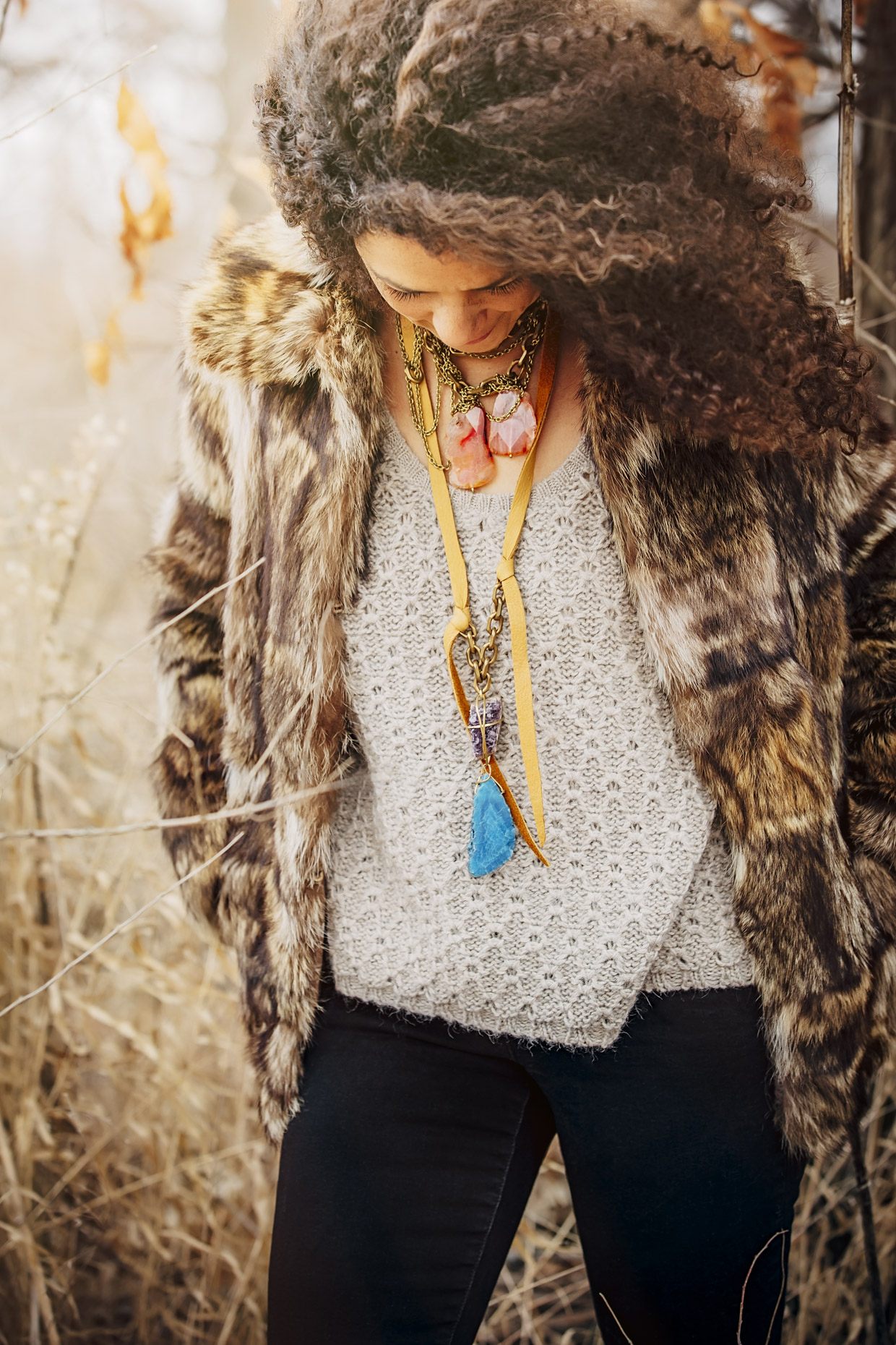 Woman in fur coat and Belthazzar stone and leather necklace