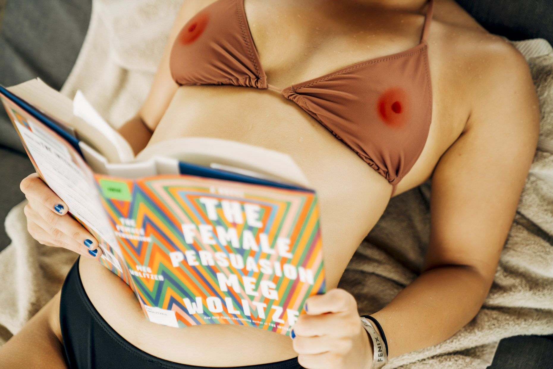 Woman in nipple bikini reading The Female Persuasion by Meg Wolitzer